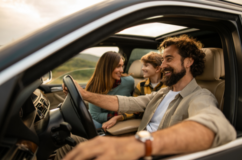 Group of friends driving a recently purchased used car from Enterprise Car Sales