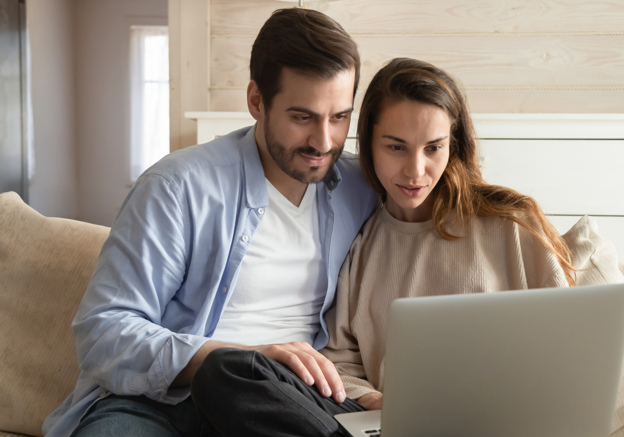 Couple comparing The Police Credit Union's Credit Card and Personal Loan to determine which product fits their needs. 